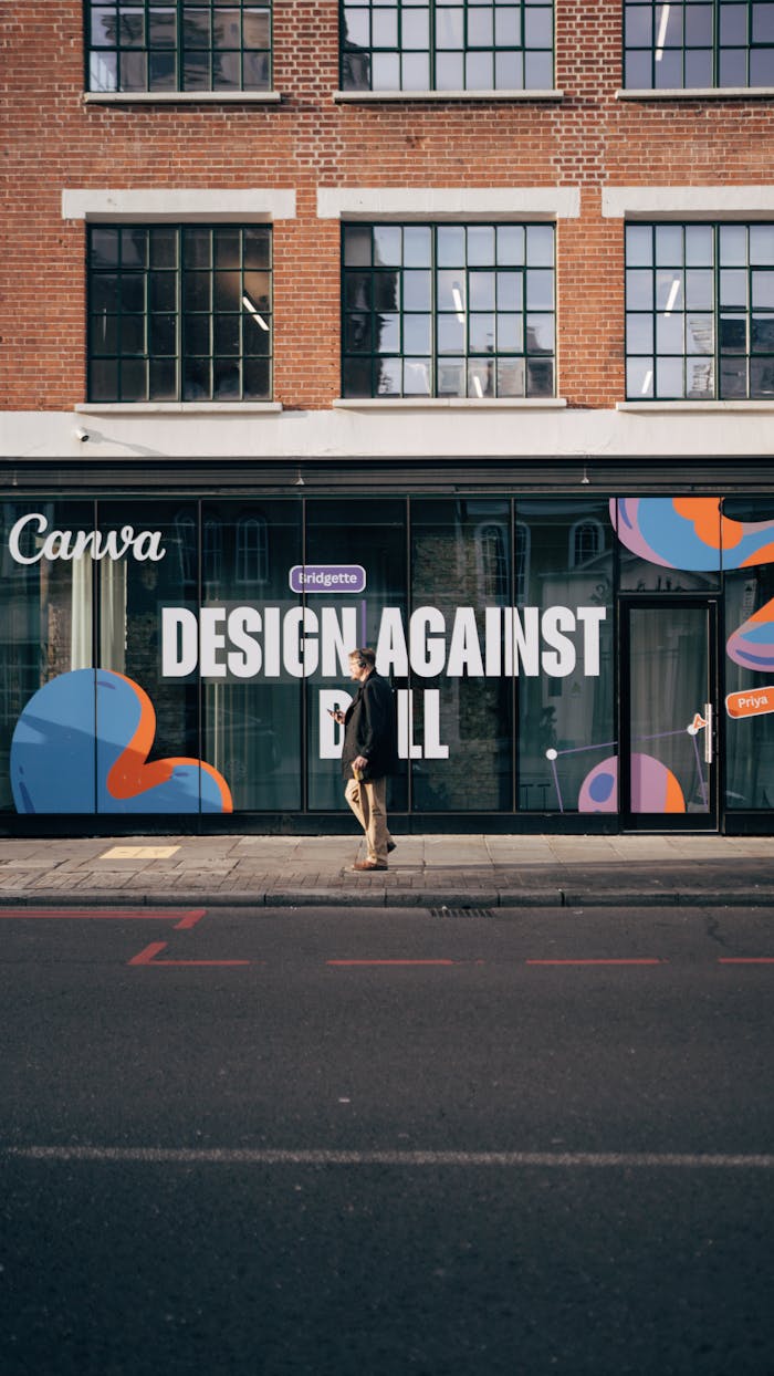 why-choose-us Person walking along a creative workspace exterior with bold design.