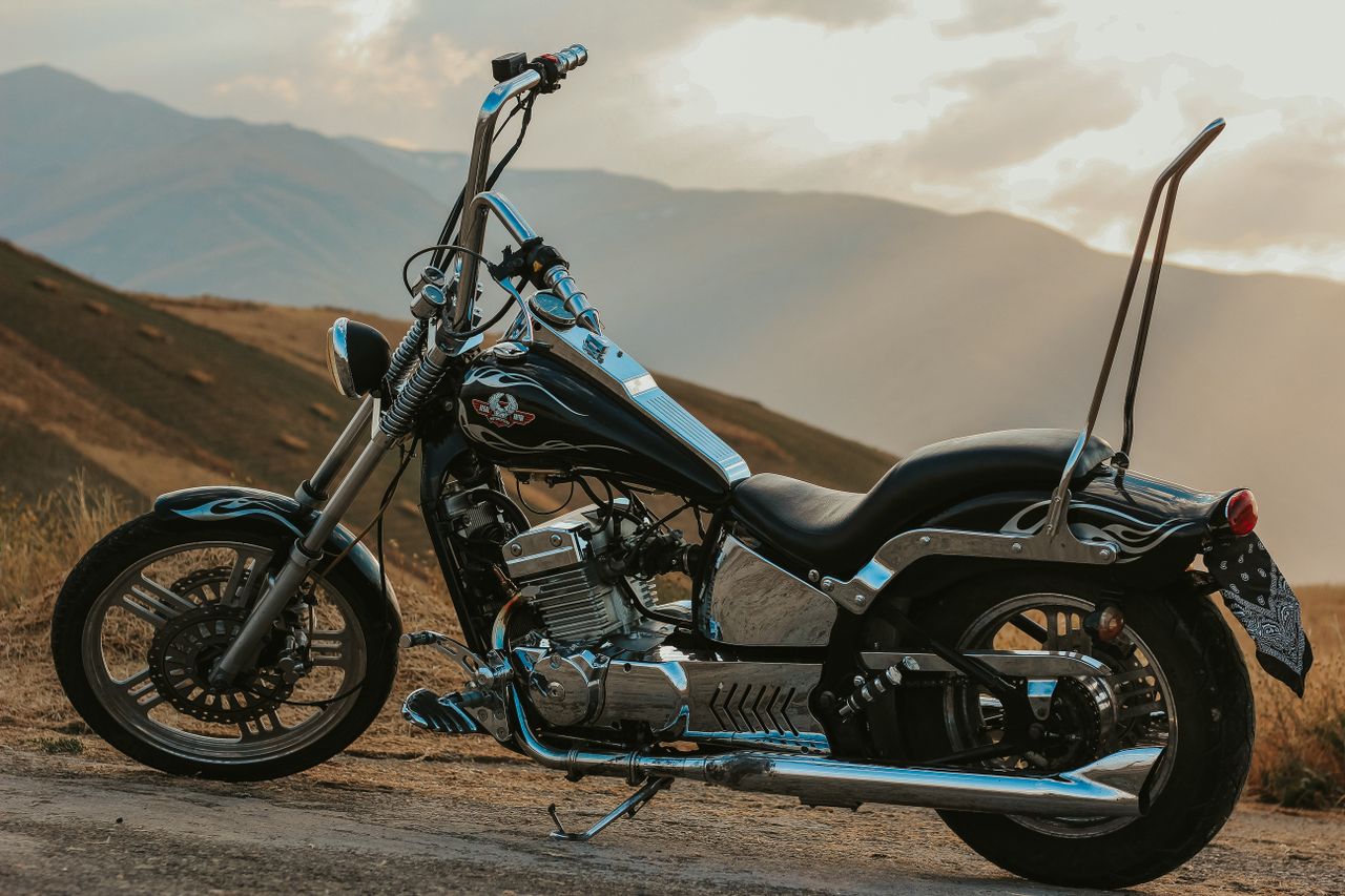 The Art of Drawing Readers In: Your attractive post title goes here Custom chopper motorcycle parked in a scenic mountainous area in West Azerbaijan, Iran.